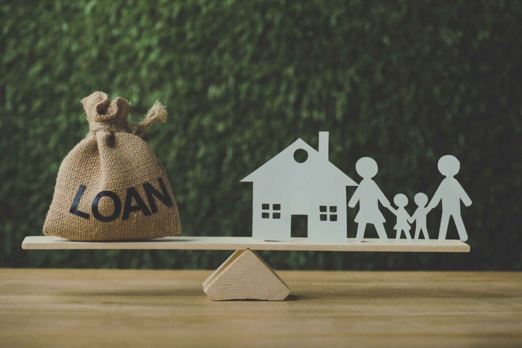 First-time homebuyer approved for a USDA Loan through Newport Capital Funding standing in front of new house